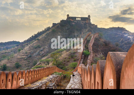 Ancient long wall with towers around Amber Fort, and view of Jaigarh Fort. Jaipur. Rajasthan. India Stock Photo