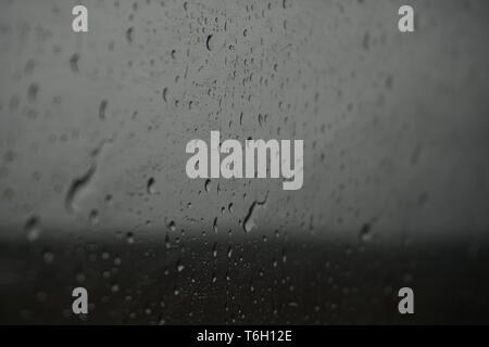 Raindrops from the inside of a train window Stock Photo