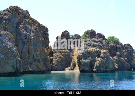 View the stone islands in the Aegean Sea Turkey Greece, rocky coastline deserted near Icmeler Marmaris summer holiday trip Panorama landscape Stock Photo