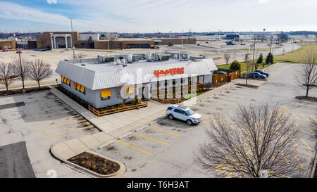 Hooters is an American chain restaurant that is known for its chicken wings, burgers, drinks and 'Hooter Girls' with over 420 locations. Stock Photo