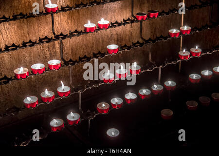 Red Memory Candles Burning In Chapel Stock Photo