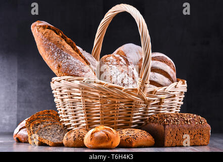 Composition with assorted bakery products in wicker basket Stock Photo