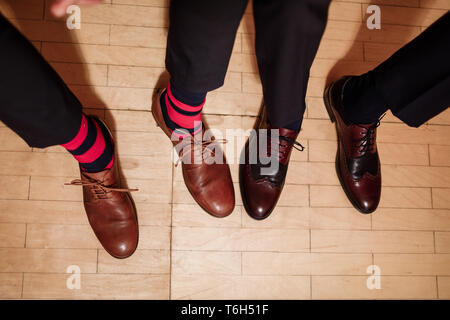 Men's feet in stylish shoes and funny socks. male style Stock Photo