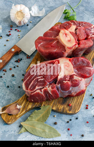 Two pieces of raw beef shank and spices. Stock Photo