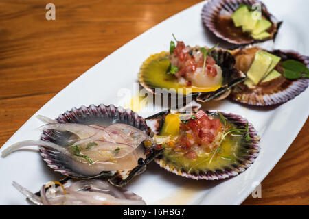 fresh scallops new peruvian cuisine style Stock Photo