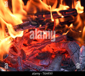 Bright flame of fire. Fire and embers. Selective focus. Texture closeup background Stock Photo