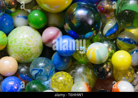 Glass marbles of different colors and sizes Stock Photo