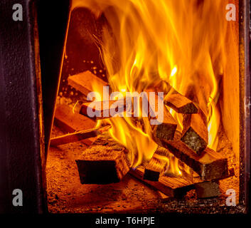 burning firewood in the fireplace Stock Photo