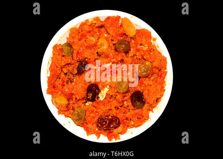 gajar halwa is carrot based pudding made with khya,milk,almond,pistachio. Stock Photo