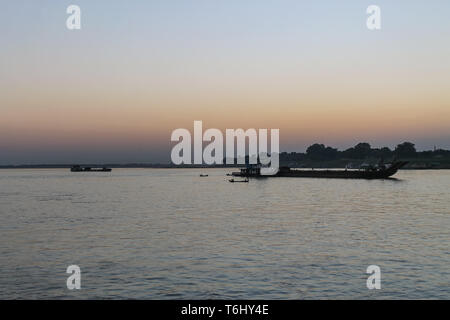 Sunset over the Irrywaddy River in Myanmar seen from a Passanger Boat traveling from Mandalay to Bagan Stock Photo