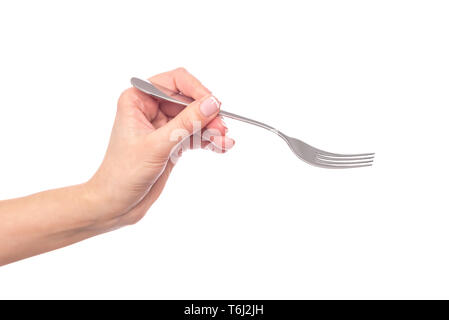 Fork in female hand on white background. Stock Photo