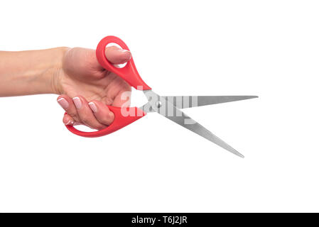 Scissors in female hand on white background. Stock Photo