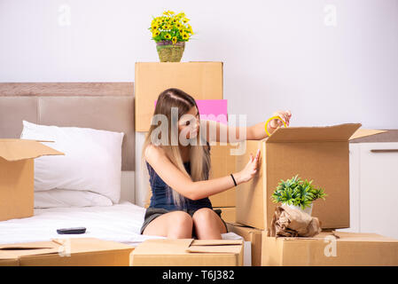 Young woman moving to new place Stock Photo