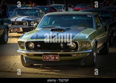 Green 1969 Mach 1 on show at 2019 Mustang Nationals Melbourne, with blue 1968 Fastback and others in the background on Birrarung Marr Stock Photo