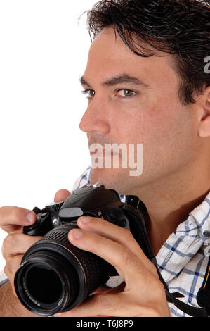 A young man holding his camera for a shoot Stock Photo