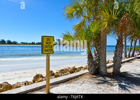 A Yellow Do Not Enter Water Sign posted in a Parking Area at the Beach Stock Photo