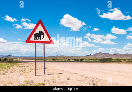 Elephants crossing road warning sign, Damaraland, Namibia Stock Photo