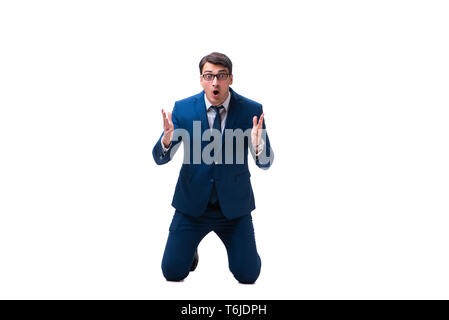 Excited businessman siiting on the knees isolated on white backg Stock Photo