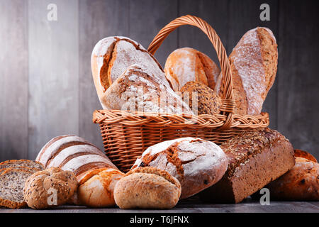 Composition with assorted bakery products in wicker basket Stock Photo