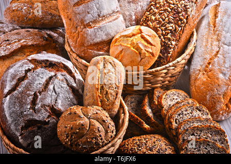 Composition with assorted bakery products in wicker basket Stock Photo