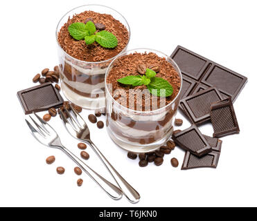 two portions Classic tiramisu dessert in a glass and chocolate bar isolated on a white background Stock Photo