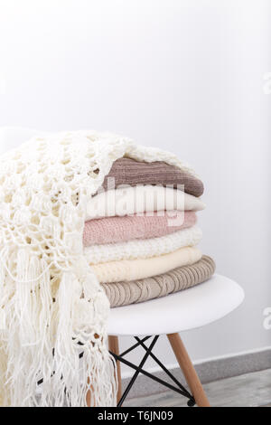 Stack of cozy knitted sweaters Stock Photo