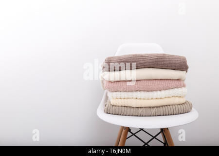 Stack of cozy knitted sweaters Stock Photo