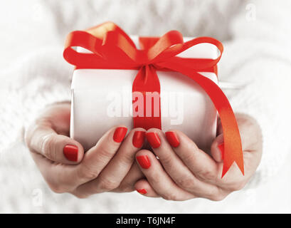 Small gift box in hands Stock Photo