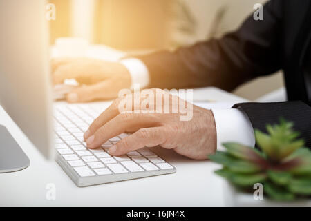 Male businessman typing Stock Photo