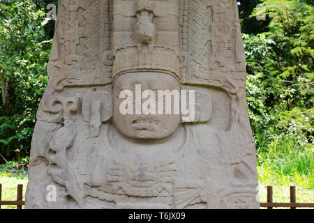 Mayan ruins - Standing stone Stele K erected by ruler Jade Sky in the 9th century AD; Quirigua UNESCO World Heritage site, Guatemala Latin America Stock Photo