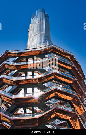 New York City, NY / USA - April 01, 2019: The vessel, a modern art, honeycomb like staircase in the center of the Hudson Yard open for visitors on a s Stock Photo