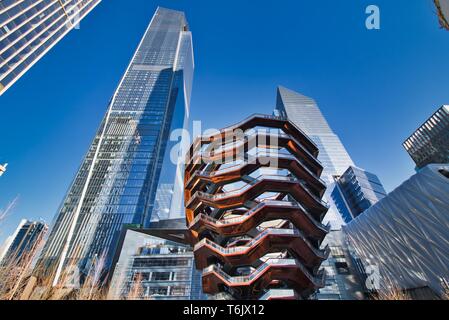 New York City, NY / USA - April 01, 2019: The vessel, a modern art, honeycomb like staircase in the center of the Hudson Yard open for visitors on a s Stock Photo