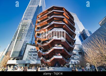 New York City, NY / USA - April 01, 2019: The vessel, a modern art, honeycomb like staircase in the center of the Hudson Yard open for visitors on a s Stock Photo