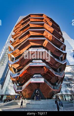 New York City, NY / USA - April 01, 2019: The vessel, a modern art, honeycomb like staircase in the center of the Hudson Yard open for visitors on a s Stock Photo