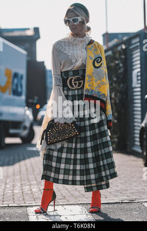 Milan, Italy - February 21, 2019: Street style – Gucci purse