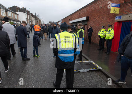 A Spurs travel steward at Selhurst Park before a FA Cup game against Crystal Palace, London. Stock Photo