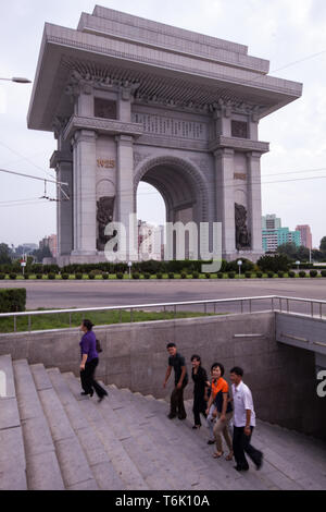 People emerge from an underground station at the Arch of Triumph in Pyongyang, North Korea. Stock Photo
