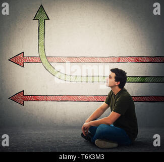 Side view of seated man imagine arrows as ideas, one changing direction benting go up, as a progress raising graph. Life change and growth symbol, dif Stock Photo