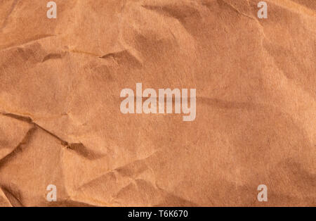 twisted Brown Kraft Paper Textured Background Top View. Stock Photo