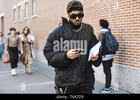 Milan, Italy - February 21, 2019: Street style – Man wearing Fendi before a fashion show during Milan Fashion Week - MFWFW19 Stock Photo
