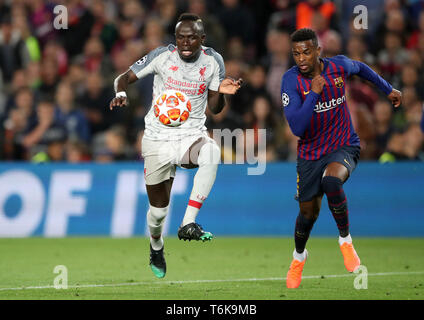 Liverpool's Sadio Mane and Barcelona's Cabral Nelson Semedo battle for the ball during the UEFA Champions League semi final first leg match at the Nou Camp, Barcelona. Stock Photo