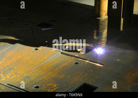 laser cutting torch machine in an industrial plant cuts sheet metal. Industry Stock Photo