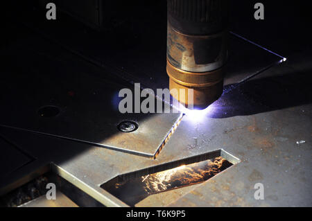 laser cutting torch machine in an industrial plant cuts sheet metal. Industry Stock Photo
