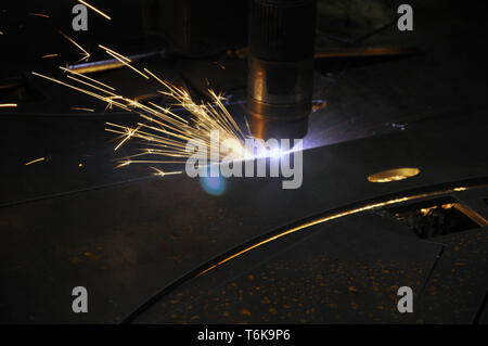 laser cutting torch machine in an industrial plant cuts sheet metal. Industry Stock Photo