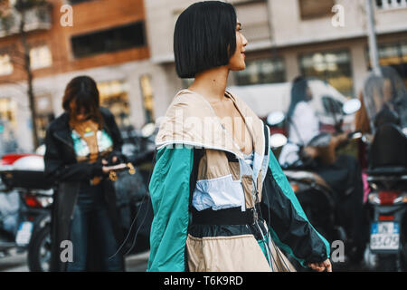 Milan, Italy - February 22, 2019: Street style outfit - models, bloggers and influencers before a fashion show during Milan Fashion Week - MFWFW19 Stock Photo