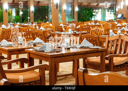 Glasses and plates on table in restaurant Stock Photo