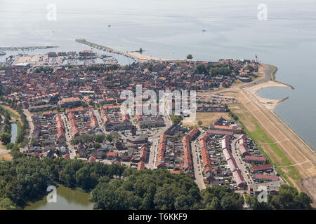 Aerial view Dutch fishing village with harbor and residential area Stock Photo