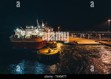 Editorial 03.29.2019 Mariehamn Åland. MS Rosella moored in the empty port at night seen from the leaving MS Silja Symphony Stock Photo