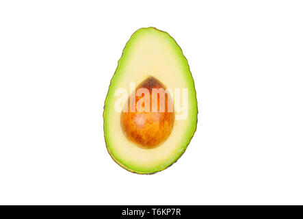 Half avocados levitate in air on white background. Concept of vegetable levitation. Stock Photo