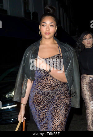 Jordyn Woods wears a see-through leopard dress to celebrate her mother